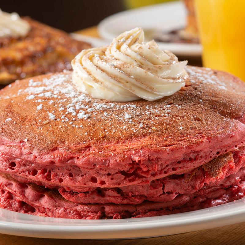 Hudson Cafe signature dishes Red Velvet Pancakes, Voodoo Eggs Benedict (Catfish Bennies), Cinnamon Swirl Pancakes, Fruity Pebble French Toast, Shrimp & Grits.